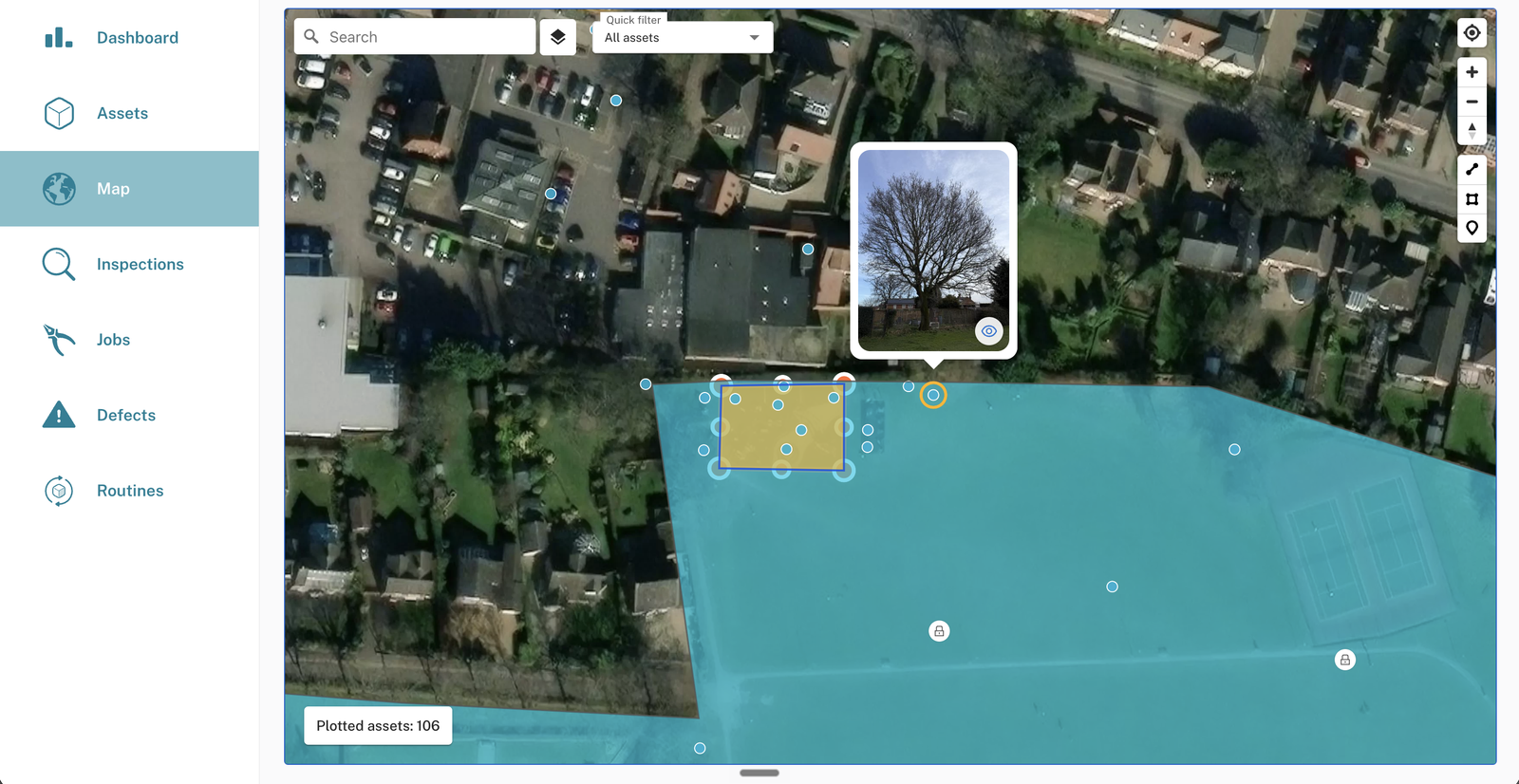 Satellite view showing a small ochre area drawn inside a larger teal area, with the smaller one selected